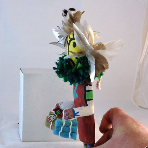 Qoqole (Yellow) giving gifts kachina